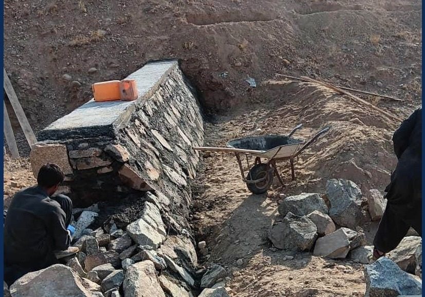 Community infrastructure under construction — schools & clinics.